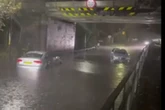 Hero dad wades into flood water to rescue stuck driver