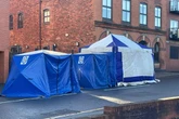Police incident live as Clement Street blocked off and blue tents erected