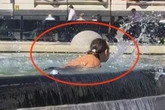 Real-life addition to floozie fountain as woman takes a dip in 32C heat