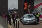 Watch - Broad Street drama as police arrest semi-naked man after pulling him from car roof