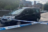 Birmingham police incident as officers cordon off taxi in middle of street