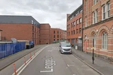 Men wearing crash helmets in Jewellery Quarter raid