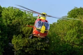 Two rushed to hospital after train crashes into tractor near Midlands farm