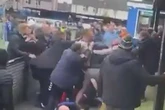 Moment violent scenes break out at football match in front of children as game called off
