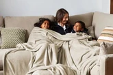 Dunelm's £25 supersize family throw that's perfect to 'cuddle under on a chilly night'