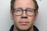 Mugshot of sick doctor found with 'paedo manual' and hoard of 'horrific' child images