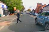 Watch moment dangerous driver runs red light and nearly mows down pedestrian