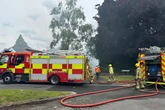 Sutton Coldfield fire live as seven crews battle thatched roof blaze