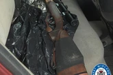 Two arrested after sawn-off shotgun and a rifle found in car