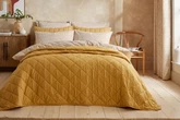 Shoppers adore Dunelm bedspread's 'attractive colour' now half price for 'chilly nights'