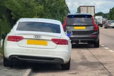 Audi driver in handcuffs amid police concern for female passenger