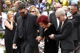 Kelly Osbourne says Ozzy 'shining down on us' in visit to Black Sabbath bench after dad's award