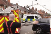 Birmingham house fire destroys roof and blocks road for hours