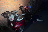 Thugs wearing balaclavas seen pushing mobility scooter down street