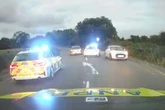 Moment driver in 'Britain's slowest police chase' tries to flee at 5mph