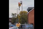 Watch as flags put up in Stirchley with cherry picker after others taken down