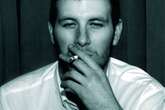 Arctic Monkeys fans shocked to learn who cigarette smoker is on album cover