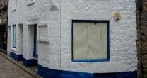 Shop in posh seaside town that controversially turned blue is repainted white