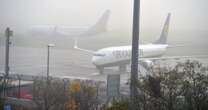 Travel chaos at Manchester Airport as dense fog causes major delays to flights