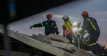 Dozens of people buried in rubble after South African apartment building collapses killing sevenSouth Africa