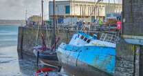 Sunken fishing boat leaves 'stinking' oil leaking into beauty spot harbourFishing