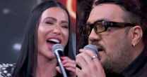Belo e Gracyanne Barbosa se encontram ao vivo na TV e Luciano Huck entrega climão: 'Ele perde a linha quando ela está'