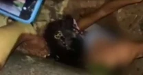 Menina entra em bueiro para ajudar a resgatar amigo na Bahia