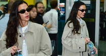 Trench coat cáqui, conjunto listrado e bolsa Gucci de R$ 12 mil: o aerolook comfy e elegante de Bruna Marquezine ao voltar dos EUA
