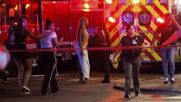 Drive-by shooting leaves four dead and 14 wounded, police say