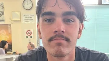 Missing surfer, 19, found marooned on island 12km from shore