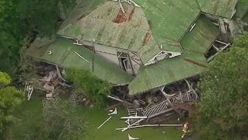 Queensland house collapses with woman, 85, inside