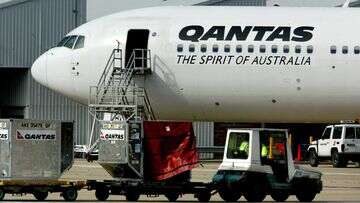 Woman and child hospitalised after turbulence on Qantas flight to Brisbane