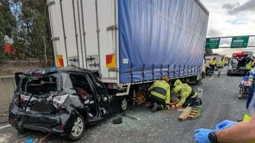Woman trapped in car between two trucks after horror Sydney crash