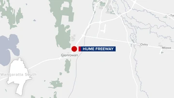 One dead after driver crashes into parked trucks as people slept inside