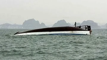 Tourist boat capsizes in Vietnam, killing 34 and trapping dozens more