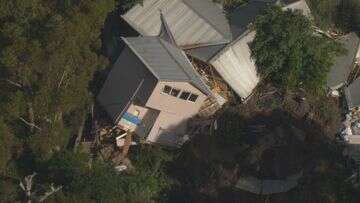 House destroyed after sliding down steep hill in apparent landslide