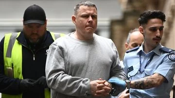 Father admits gunning down man on suburban street but says it's not murder