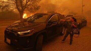 Los Angeles residents flee fire as potentially 'life-threatening, destructive' winds gain strength