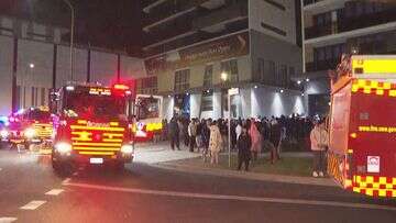 Hundreds evacuated from unit complex as car burns in Sydney