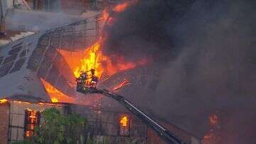 Exclusion zone in place as major fire burns in Woolloongabba