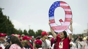 QAnon conspiracy theorists may become more violent, FBI warns