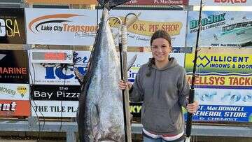 Emma broke three world records after reeling in this 125kg monster