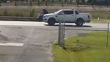 Footage shows ute driver knocking motorcyclist over in highway hit-run