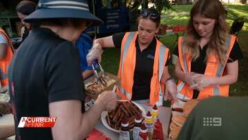 Shoppers help Christmas angels fire up barbecue for Aussies in need