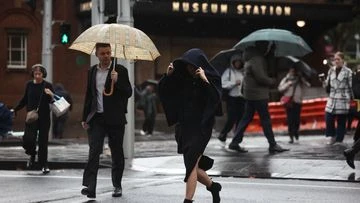 Sydneysiders face train delays, road closures as rain system moves south