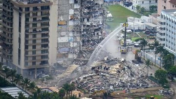 Flames hamper rescue effort amid rubble of Florida condo