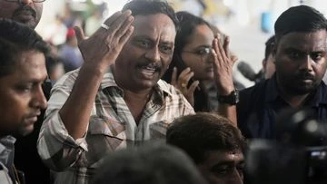 Death toll in Indian plane crash climbs as authorities race to identify victims