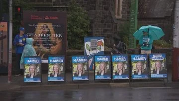 Liberal Party escalates legal stoush after campaign signs taken from pre-poll station