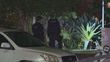 Manhunt after trio storm home with machetes in Sydney's east