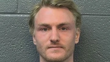 Man in custody after US council member set on fire over 'personal matter'